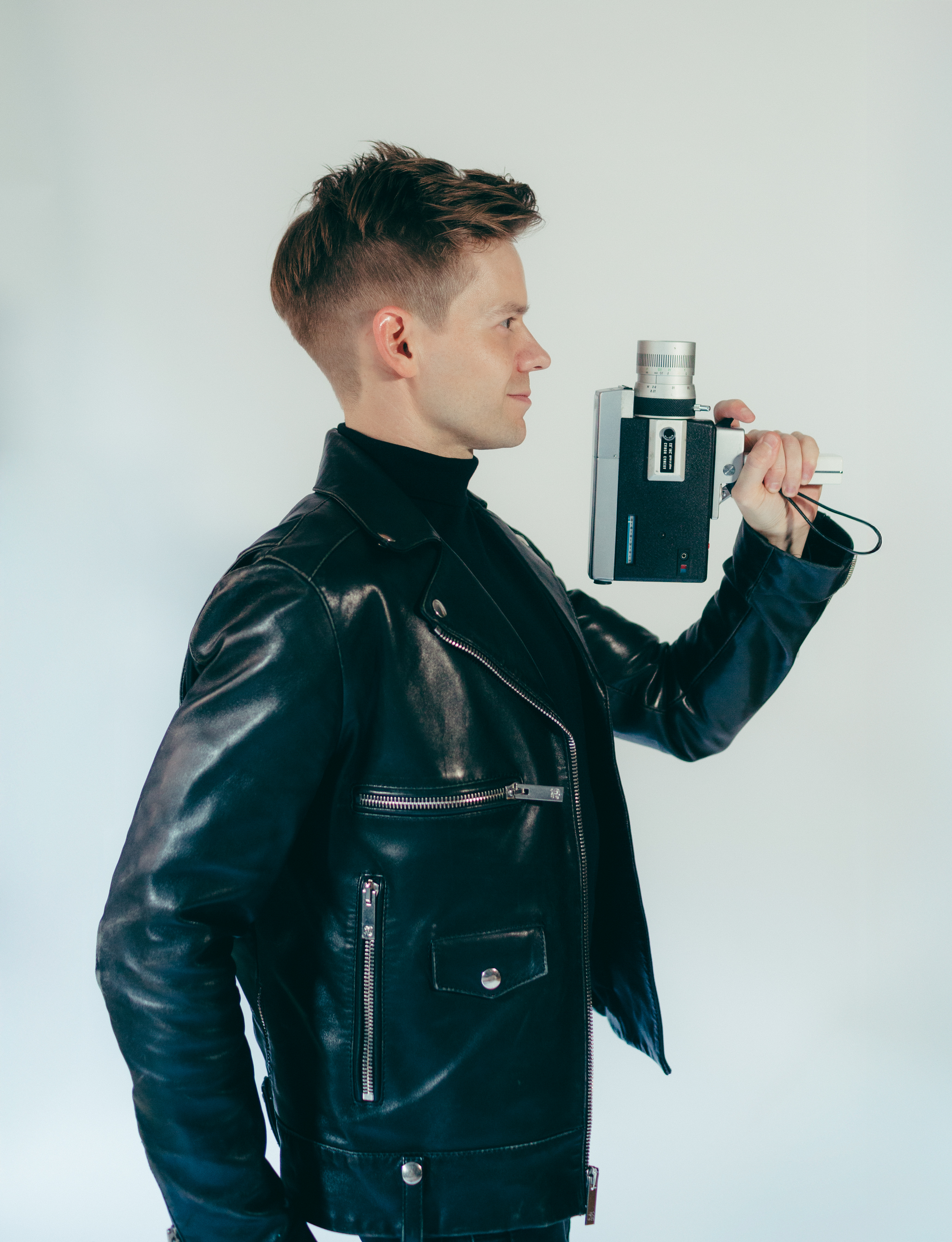Andrew Keenan-Bolger holding a vintage film camera